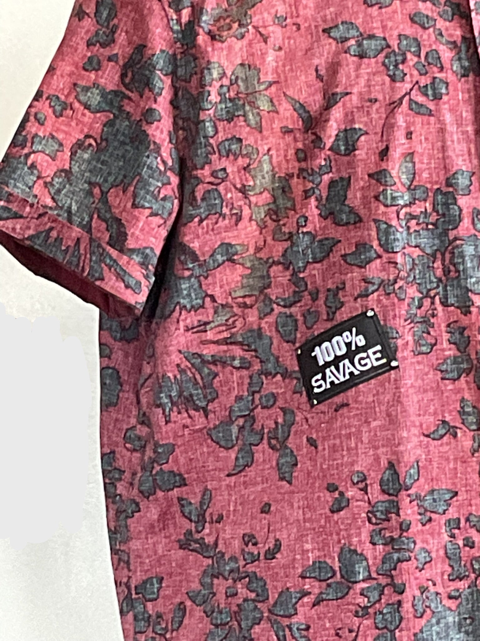 Red short-sleeve top with black floral design, 100% SAVAGE patch, titled I'M OUTTA HERE, 2XL, embodying DEVIOUS SAINT's bold and unique style.