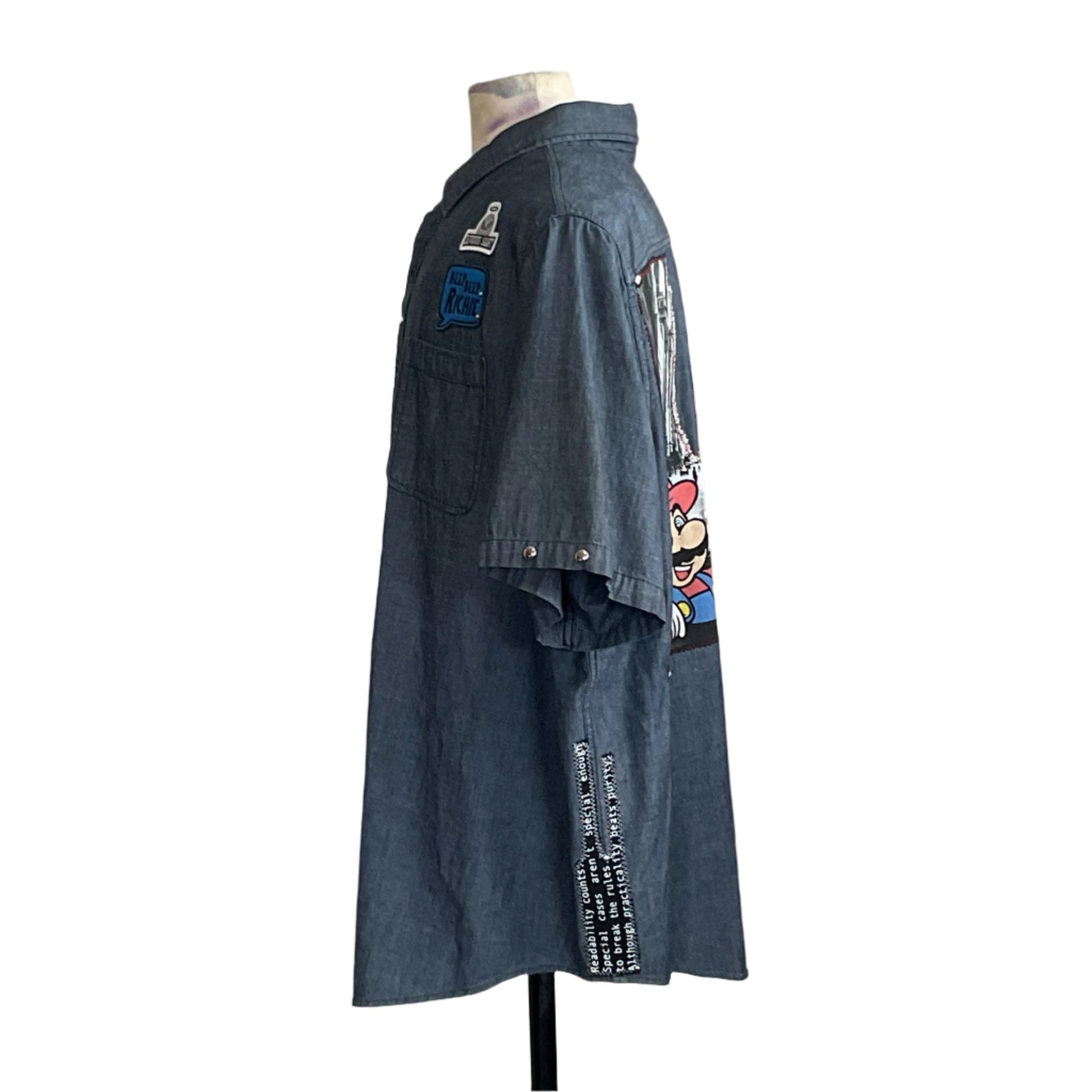 Headless mannequin in MARIO Men's Custom BEAR SIZE Short Sleeve Shirt with Mario graphic, patches, and text details, embodying unique style in 4 XL.