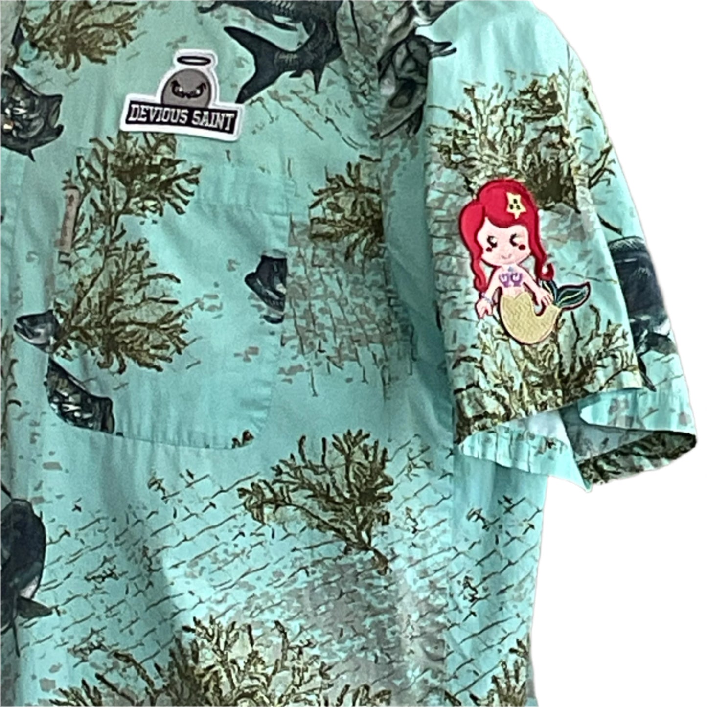 AQUA BONE FISH shirt with underwater motif, DEVIOUS SAINT patch, and mermaid embroidery, showcasing bold, unique style for extra-large, casual wear.