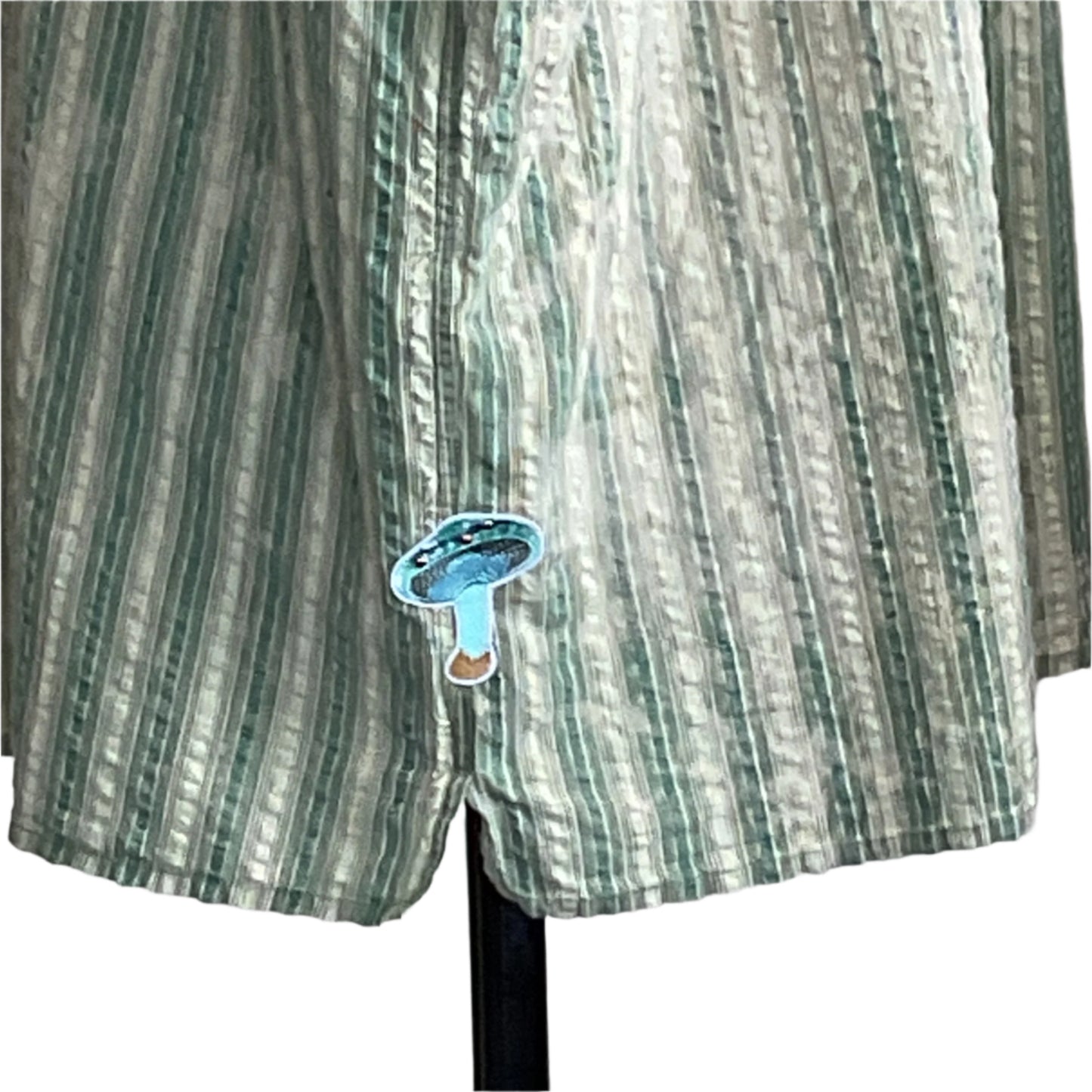 SCARY MOVIES men's 4XL shirt with light green and white stripes, features a small turquoise patch near the hem, perfect for a relaxed movie night.