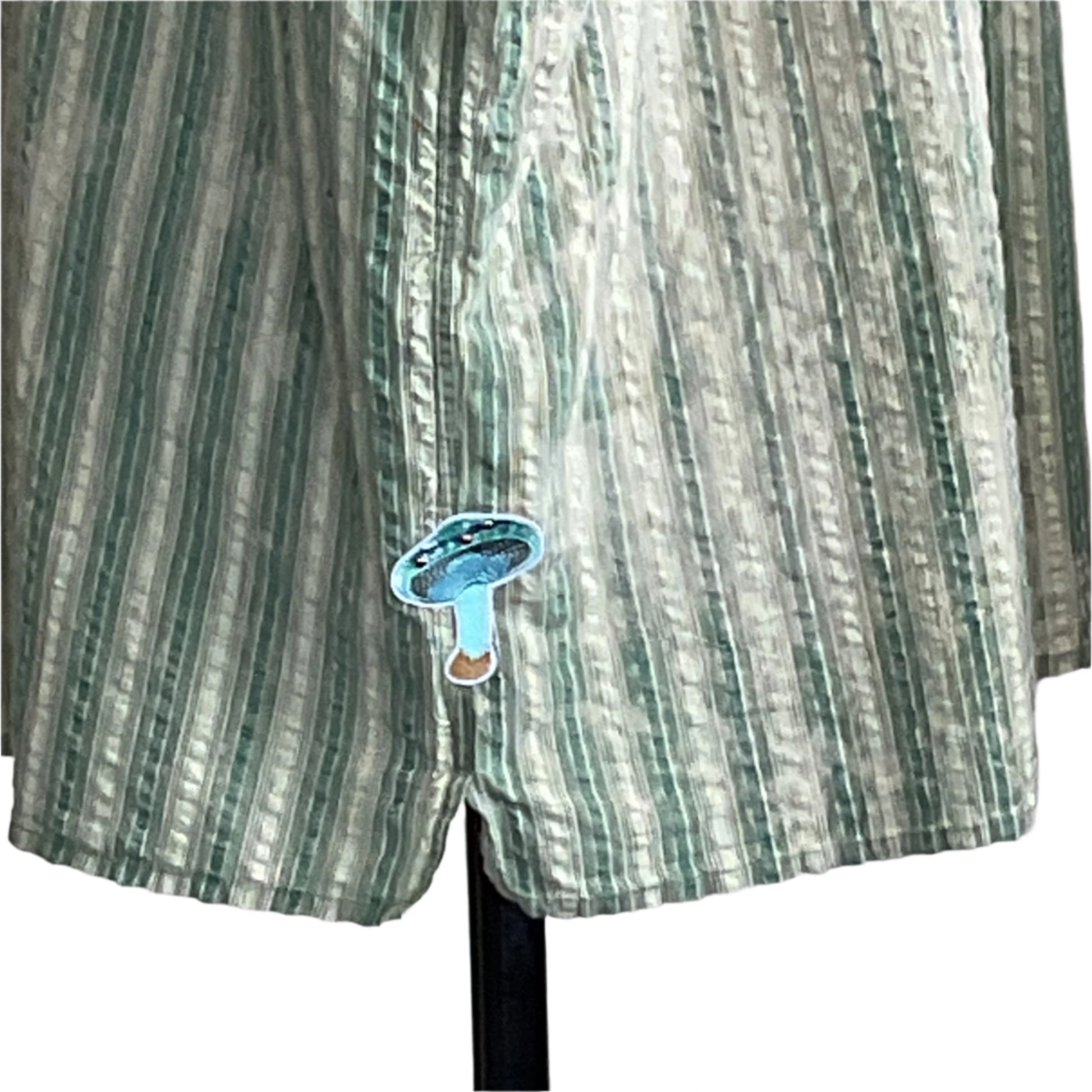 SCARY MOVIES men's 4XL shirt with light green and white stripes, features a small turquoise patch near the hem, perfect for a relaxed movie night.