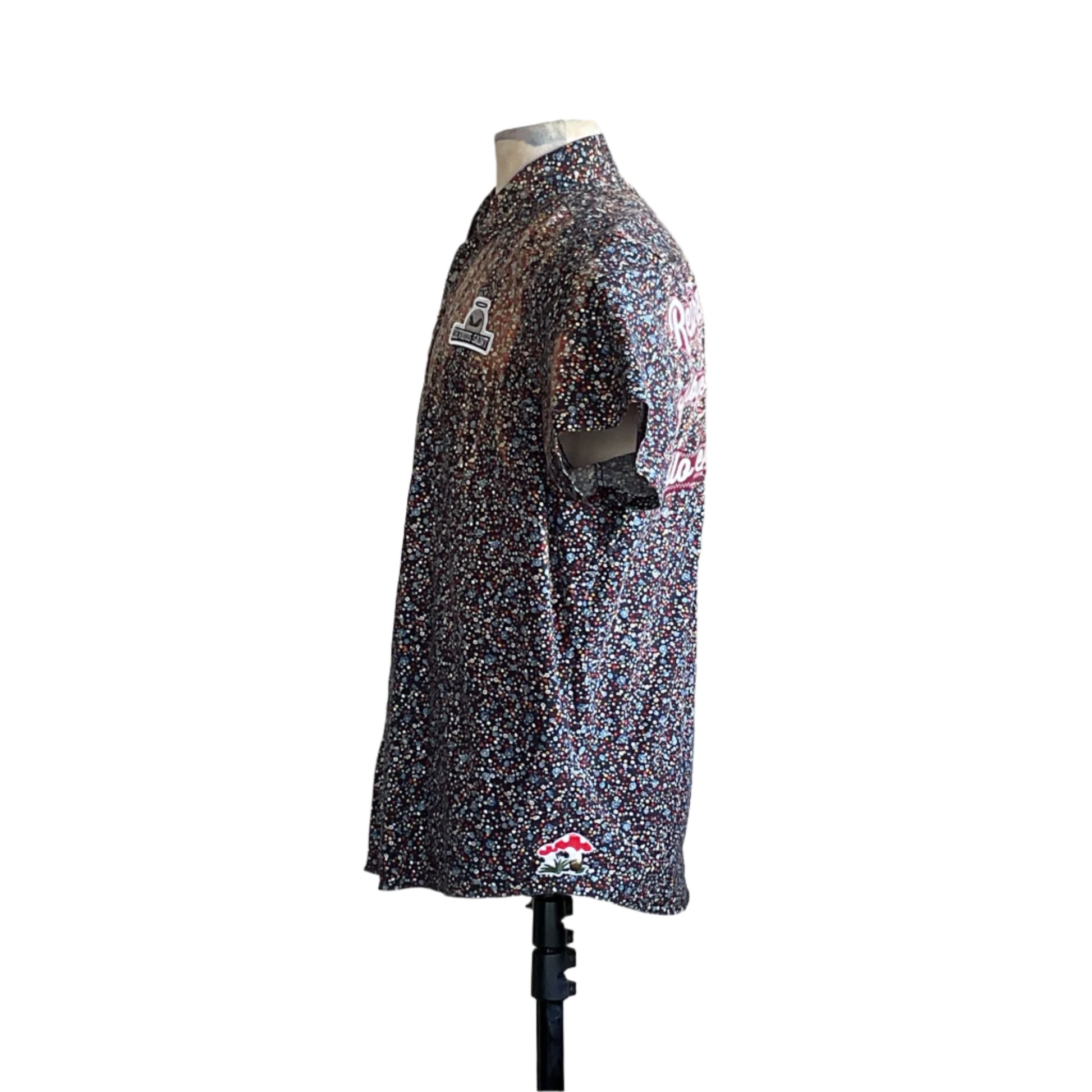 RETIRE | Men's Custom BEAR SIZE Short Sleeve Shirt; black jersey with multicolored print, white logo patch, and mushroom motif, XL size by DEVIOUS SAINT.