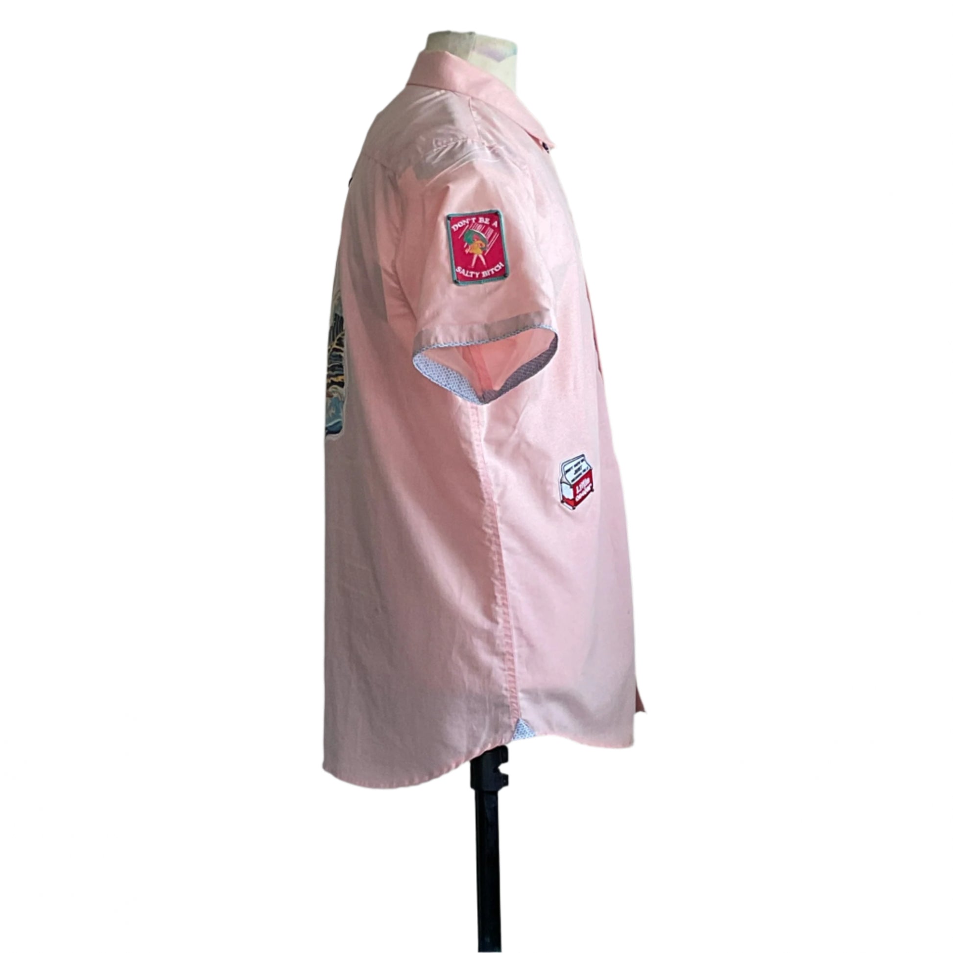 Men's Custom BEAR SIZE Short Sleeve Shirt, light-pink with patches, featuring DON’T BE A SALTY BITCH slogan. Camp collar, relaxed fit, XL size, DEVIOUS SAINT creation.
