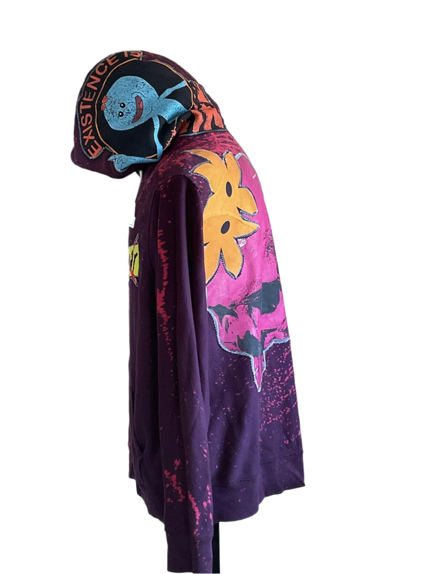 Purple pullover hoodie with splatter-dye, featuring Mr. Meeseeks graphic on hood. Bold graphics enhance the ROSES FROM CONCRETE Custom Men's Hoodie for a vibrant streetwear look.